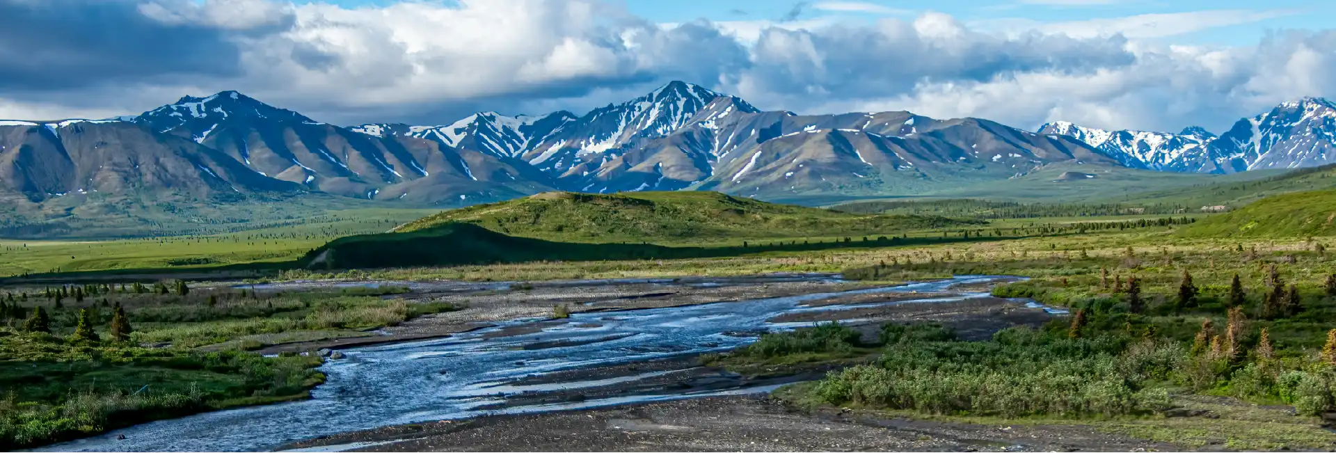Beautiful landscape with a river and mountains in the background