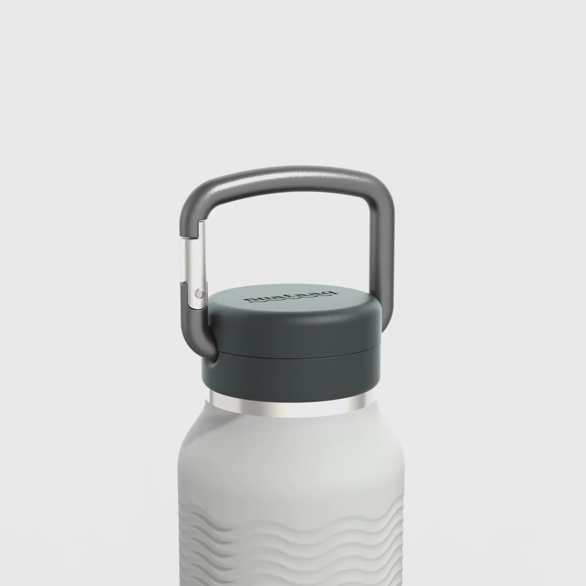 Video showing carabiner and wave grip features of the mist gray 34 oz Nuataaq carabiner bottle
