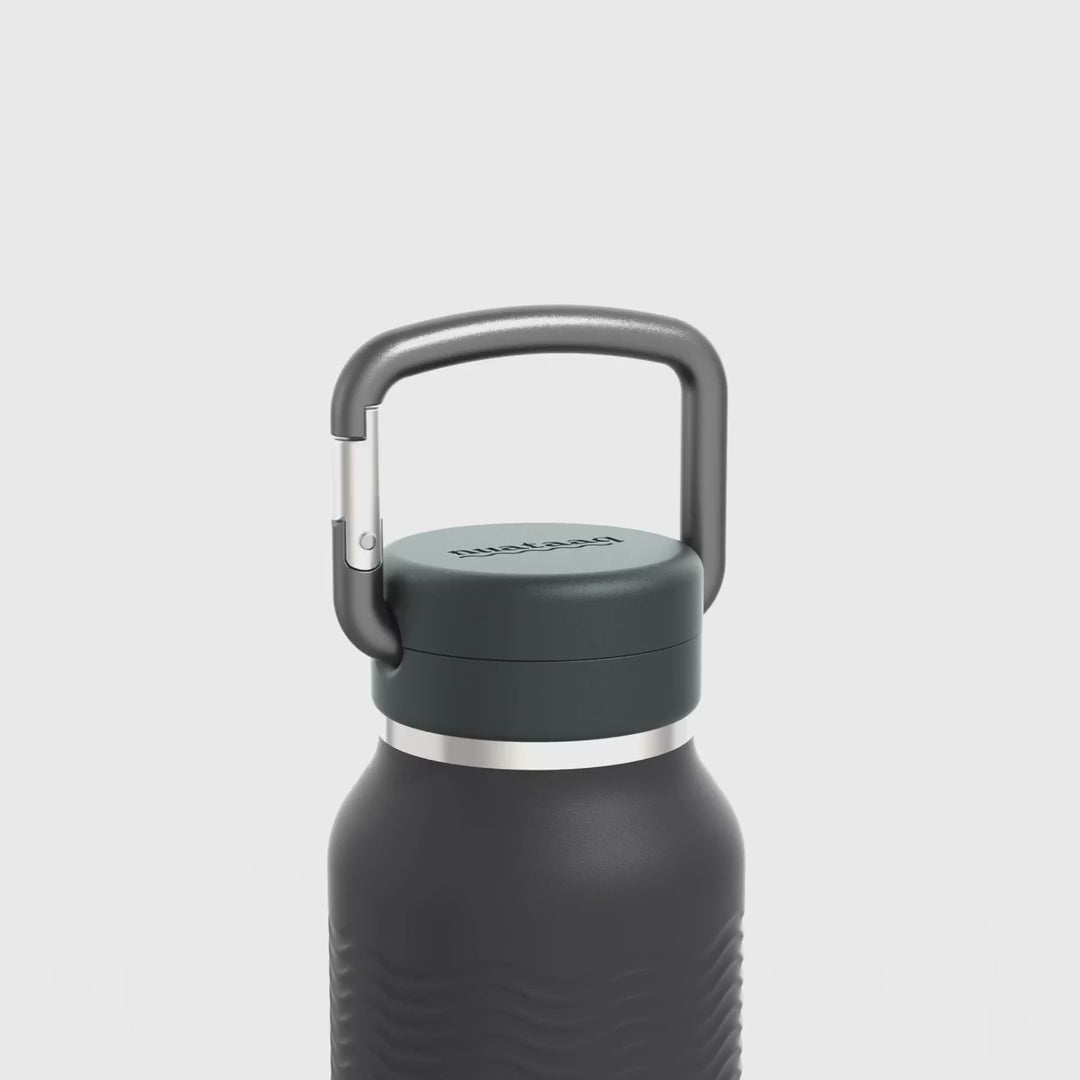 Load video: Video showing carabiner and wave grip features of the obsidian 34 oz Nuataaq connect bottle#color_obsidian