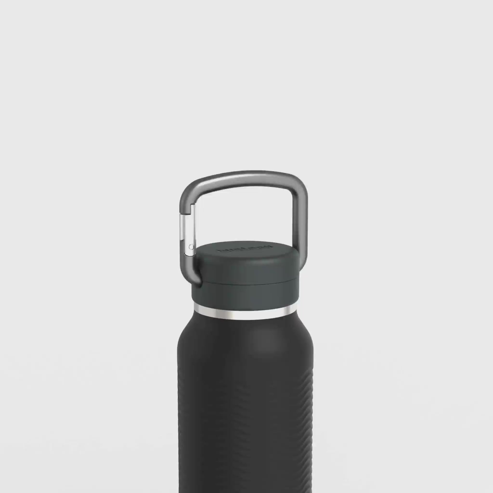 Load video: detailed video showing the components of the Nuataaq carabiner bottle including a forged aluminum carabiner, insulating foam, silicone gasket, and other features