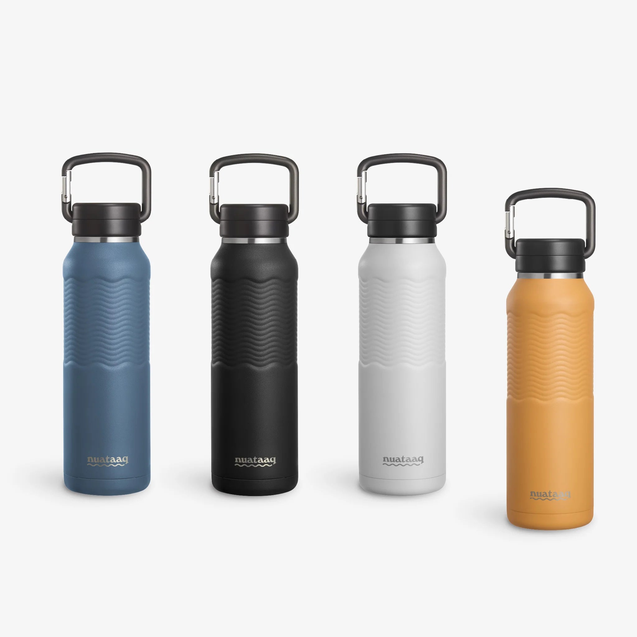 Four Nuataaq Carabiner Bottles standing upright in a row, shown with goldenrod at the front then lake blue, obsidian , and mist gray