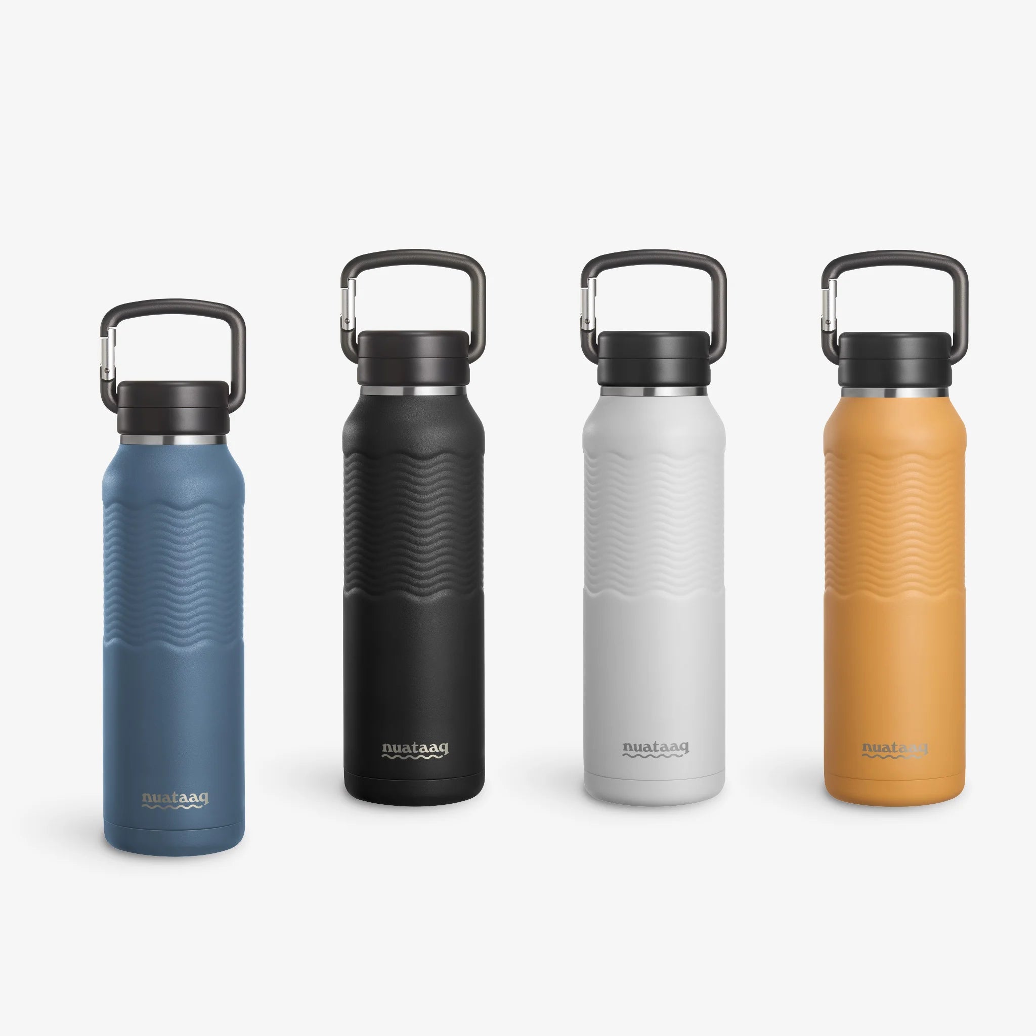 Four Nuataaq Carabiner Bottles standing upright in a row, shown with lake blue at the front then obsidian, mist gray, and goldenrod