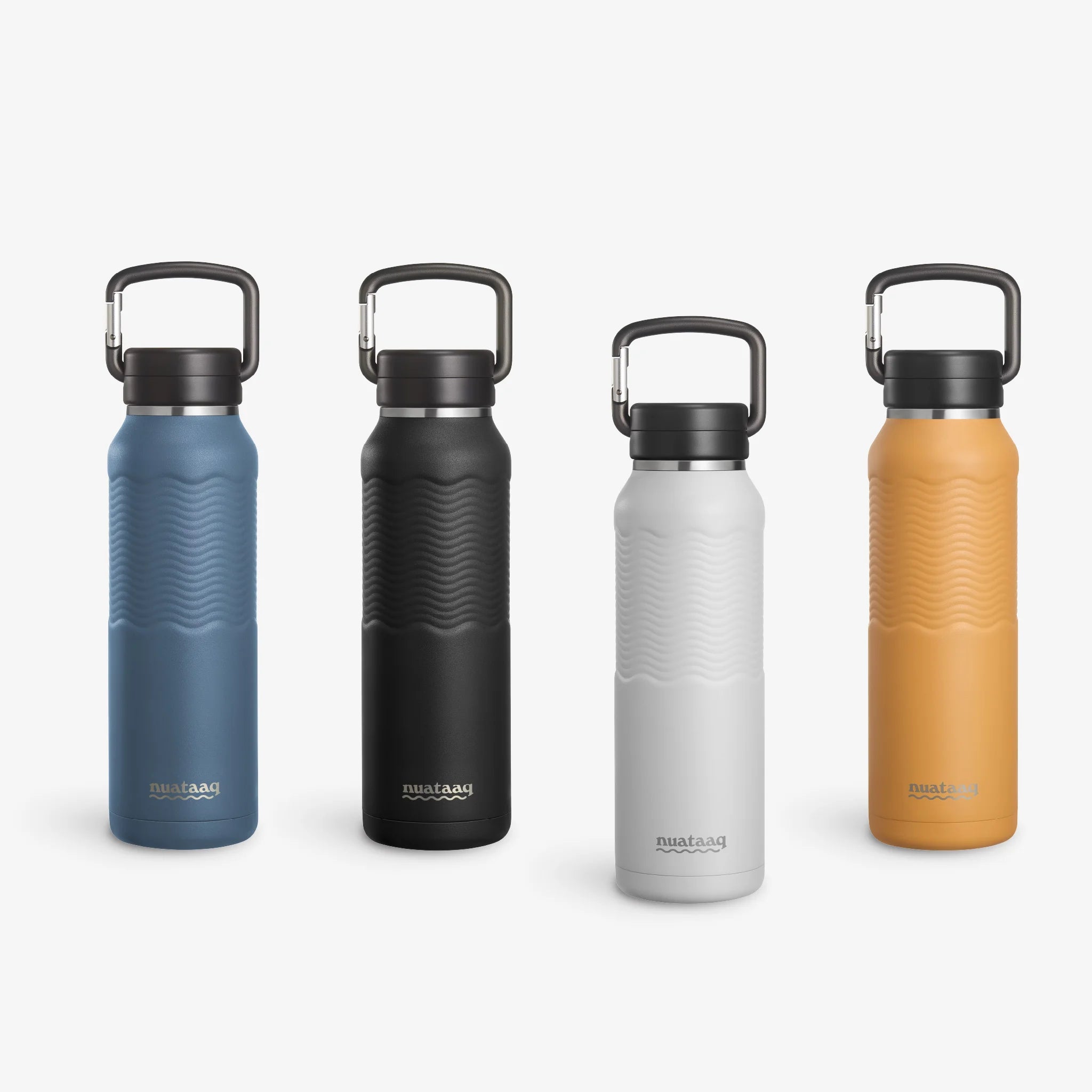 Four Nuataaq Carabiner Bottles standing upright in a row, shown with mist gray at the front then lake blue, obsidian, and goldenrod
