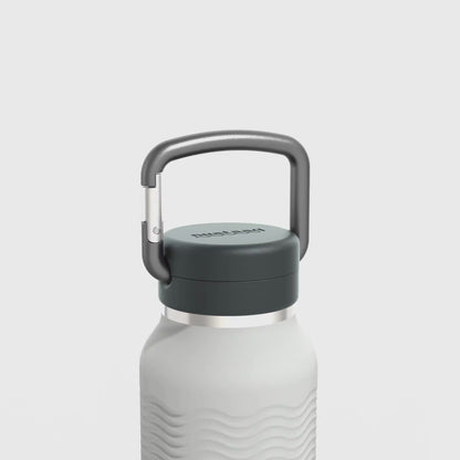 Video showing carabiner and wave grip features of the mist gray 34 oz Nuataaq carabiner bottle
