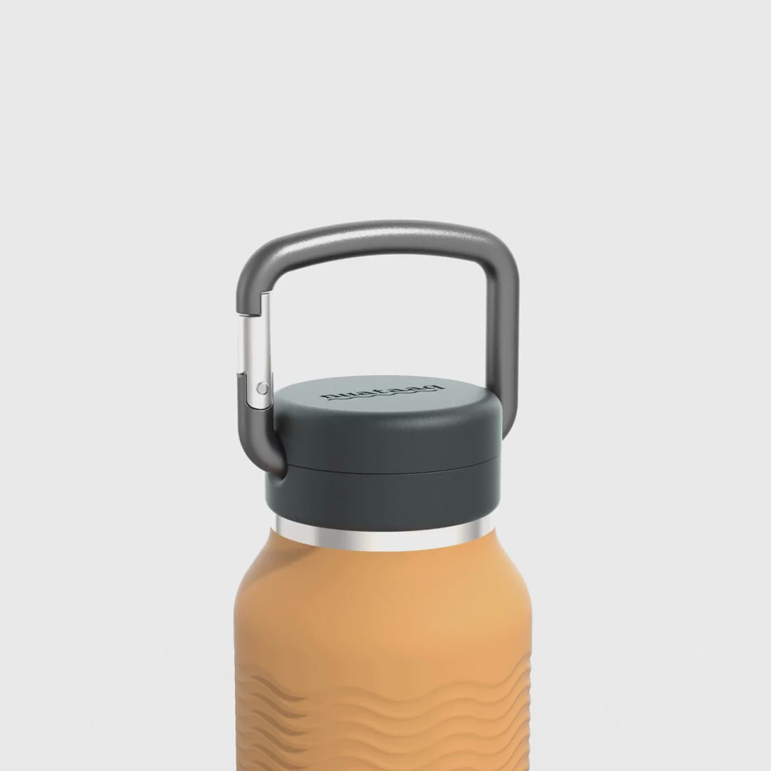 Video showing carabiner and wave grip features of the goldenrod 34 oz Nuataaq connect bottle